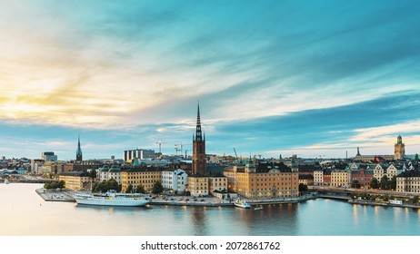 Stockholm, Sweden. Scenic View Of Stockholm Skyline At Summer Evening. Famous Popular Destination Scenic Place In Dusk Lights. Riddarholm Church In Day To Night Transition Time Lapse.