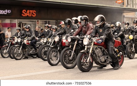 STOCKHOLM, SWEDEN - SEPT 02, 2017: Tough mc drivers in leather clothes on retro motorcycles side by side at the Mods vs Rockers event at the Saint Eriks bridge, Stockholm, Sweden, September 02, 2017