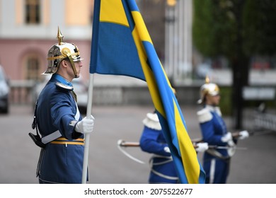 STOCKHOLM, SWEDEN - SEPTEMBER 16 2021: Swedish Royal Guards With National Flag Of Sweden In Stockholm. Protectors Of The Swedish Monarchy.