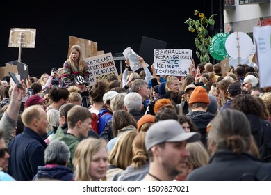 Stockholm, Sweden - September 20. 2019: Little girl and other young people protesting at the global climate strike and Fridays for Future demonstration in Stockholm.