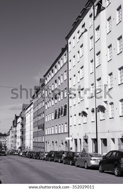 Stockholm, Sweden. Street\
view in Sodermalm. Colorful Swedish architecture. Black and white\
retro style.