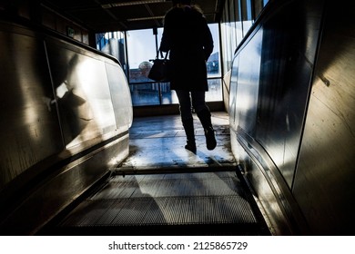 Stockholm, Sweden A Woman Goes Up An Escalator In A Tunnelbana Station.