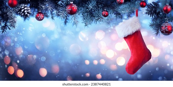 Stocking Hanging Christmas Tree - Red Sock With Snow And Bokeh Lights - Powered by Shutterstock