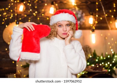 Stocking Stuffers Ideas. Candies Gift Certificates Subscriptions Tickets. New Year Celebration. Buy Or Knit Your Christmas Stocking And Stuff Them With Special Goodies. Woman Hold Red Stocking.