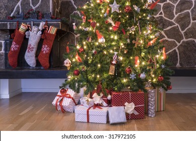 Stockings Hanging On A Fireplace Next To A Christmas Tree On Christmas Morning