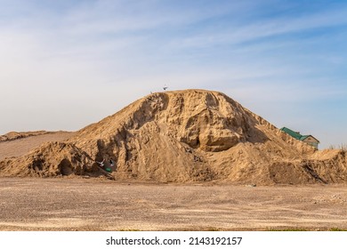 A stockpile of inert building materials. A large pile of sand and gravel. High resolution photo.