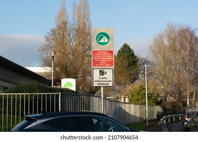 Stockport, Greater Manchester, UK. January 17, 2022. Sign for Greater Manchester Clean Air Zone in Cheadle with unidentified cars in queue.