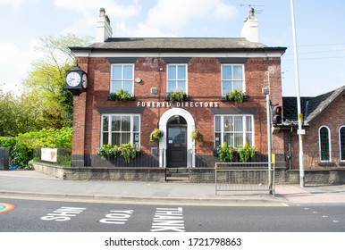 Stockport, Greater Manchester UK. May 4 2020. Funeral Directors Business. C Middleton And Son With Flowers In Window Box And Vintage Clock. Thank You NHS Road Sign Outside Stepping Hill Hospital