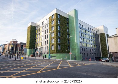 Stockport, Manchester, UK - April 10, 2022: The Mailbox apartment building in former Royal Mail sorting office with living wall.