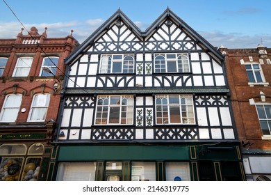 Stockport, Manchester, UK - April 10, 2022: Shop with black and white frontage, Stockport