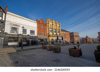 Stockport, Manchester, UK - April 10, 2022: Commercial buildings fronting onto Market Place, Stockport