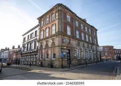 Stockport, Manchester, UK - April 10, 2022: Commercial buildings fronting onto Market Place, Stockport