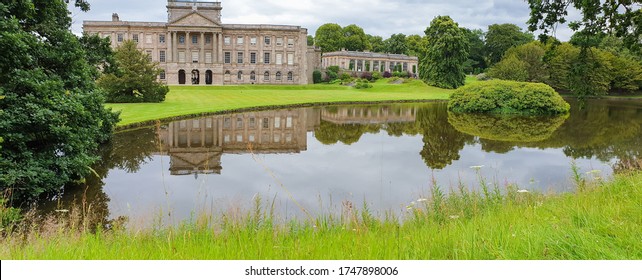 Stockport, United Kingdom - July 21, 2019: Lyme Hall historic English Stately Home and park in Cheshire, UK with people enjoying themselves in the gardens