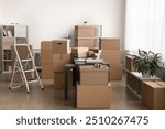 Stockroom filled with multiple various sizes cardboard boxes parcels stacked and arranged around cozy spacious room, no people. Inventory management, electronic commerce, logistics, packing workspace