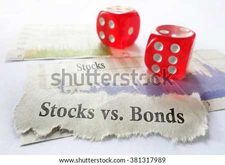 Stocks vs Bonds newspaper headline with dice and stock charts                               