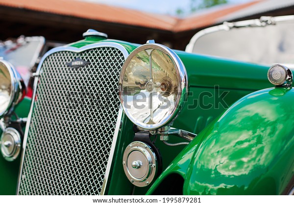 Stockton-on-Tees, UK - 06.20.21: singer motors label\
on old green car in sunny\
day