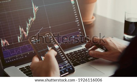 stocktrader analyzing profit opportunity investing bitcoin. trader analyzing stock trading graph phone app. investment stockbroker profit analysis. Trade graph chart. 