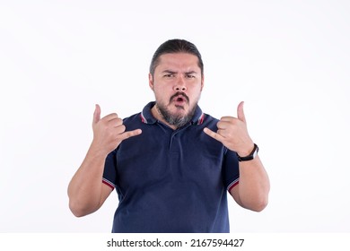 A stocky and handsome man in his 30s makes the shaka sign with both hands. Saying take it easy or that's great.