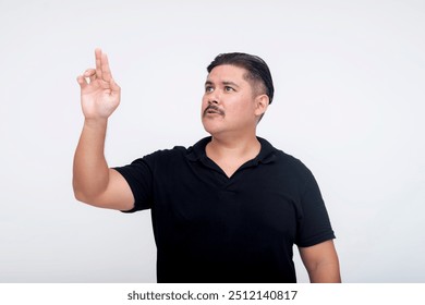 A stocky middle-aged man of mixed race interacting with a virtual screen or menu using his hands. For further editing purpose. Set against a white background.