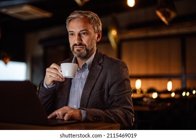 Stoic Adult Man, Taking His Work Seriously While Preparing To Sip On His Cup Of Tea.