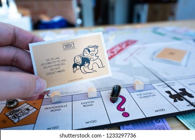 Stoke On Trent, Staffordshire - 18th November 2018 - A Player Picks Up A Chance Card In Monopoly And Gets The Go Directly To Jail Card, Do Not Pass Go Do Not Collect 200