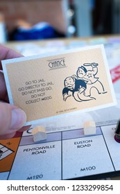 Stoke On Trent, Staffordshire - 18th November 2018 - Stoke On Trent, Staffordshire - 18th November 2018 - A Player Picks Up A Chance Card In Monopoly And Gets The Go Directly To Jail Card, Do Not Pass