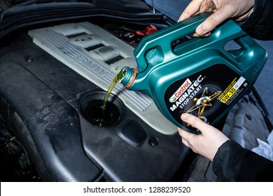 Stoke on Trent, Staffordshire - 18th January 2018 - A man fills up his BMW motor vehicle, car with Castrol Magnatec oil