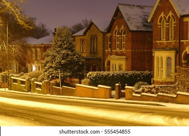 Stoke On Trent, Staffordshire, Midlands, England, UK, Europe. 12 January 2017. Nice Residential Street Covered In Snow With Beautiful Yellow Lights. Unusual Snow In Great Britain In A Small City