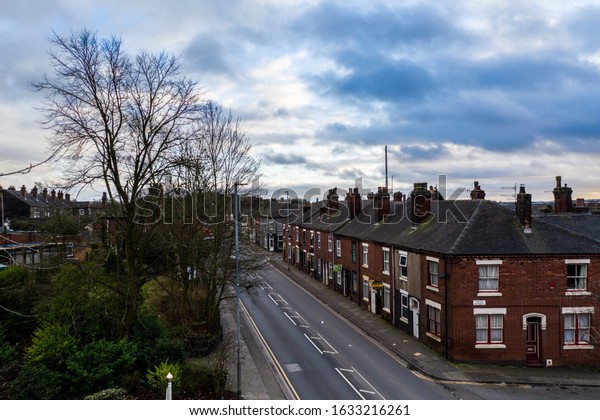 Stoke on Trent, West Midlands -  2nd February\
2020 - Pavement, sidewalk views of Victoria road, Vicky road, a\
poor area leading to the city centre of Hanley,  over population\
and poor city planning,