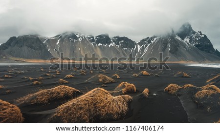 Stokksnes cape and Vestrahorn Mountain. Landscape with popular tourist attraction in Iceland. Exciting excursion to the sights view in winter