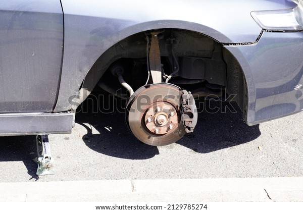 stolen car wheel on the\
street