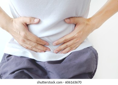 Stomach Ache Because Of Gastritis Or Menstruation That Are Sign Of Stomach Trouble.  Background White.
Health Concept