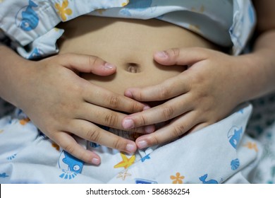 Stomach Ache Child, Child Sick, Child Girl Holding His Hands On His Belly. Stomach Pain Stock Image.