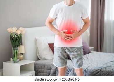 Stomach Ache, Man With Abdominal Pain Suffering At Home