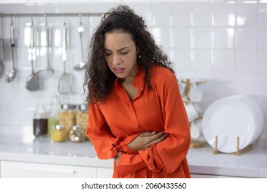 Stomach Disease, Young Woman With Stomach Ache, Having Food Poisoning In Kitchen