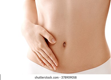 Stomach hand woman studio on white - Shutterstock ID 378909058