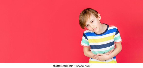 Stomach Pain. Teen Boy With Stomachache. Child Having Terrible Pain In Stomach. Diarrhea Or Gastroenteritis Health Problem. Child Has Stomachache With Food Poisoning. Child Holding Hands On Belly.