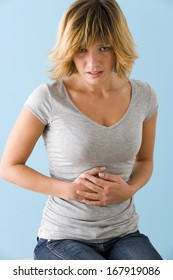 Stomach Pain In A Woman - Shutterstock ID 167919086