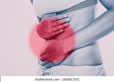 Stomach Pain Woman With Red Circle Targeting Painful Area On Lower Abdomen Body. Medical Issue Of Gut Health Or Crohn's Disease, Ibs Syndrome And More.