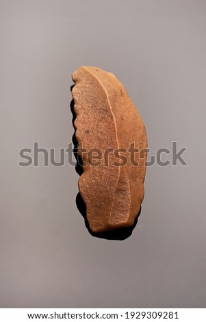 Stone age. Precious quartzite knife from the Palaeolithic period in perfect condition. on black background