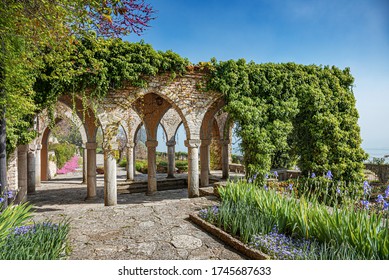 Stone Antique Gazebo In The Garden.