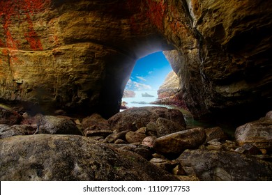 Stone arch linking Pacific Ocean to interior of  Devil's Punchbowl,  Newport, Oregon - Shutterstock ID 1110917753
