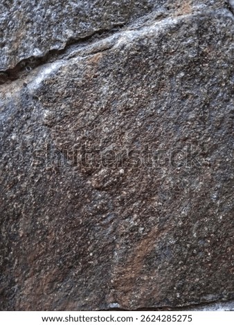 Stone background with the name Efake.