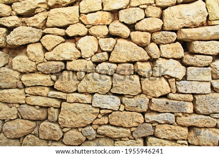Stone background texture of a wall from The Palace of Knosses on Crete in Greece near Heraklion is called Europe’s oldest city and the ceremonial and political center of the Minoan civilization.  