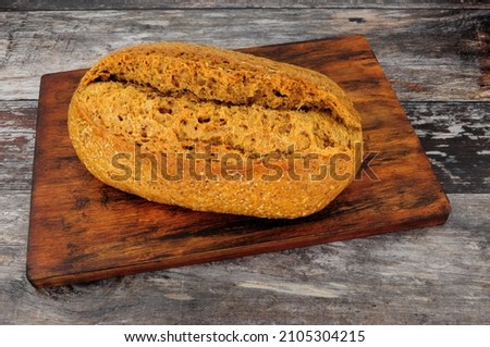 Stone baked sourdough crusty bread bloomer loaf with red rye multigrains