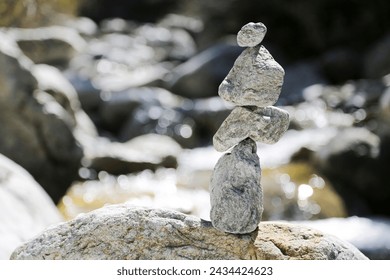 stone balancing, art of stacking or juxtaposing stones, constitutes a challenge to gravity