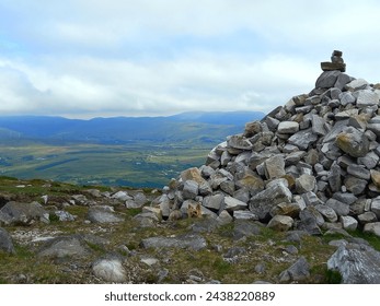 Stone balancing on the way up to the top of the cliff in Teelin, Ireland. The stone balancing resembles the patience and precision, a defying gravity form of nature.