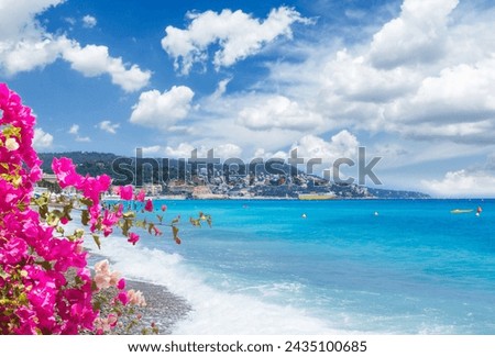stone beach and turquiose water of cote dAzur at Nice, french Riviera coast, France