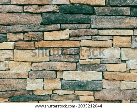 stone brick building facade wall cut and irregular shapes rock structure
