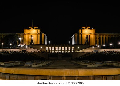 Stone And Brick Buildings At Trocadéro Gardens At Night With City Lights Paris France